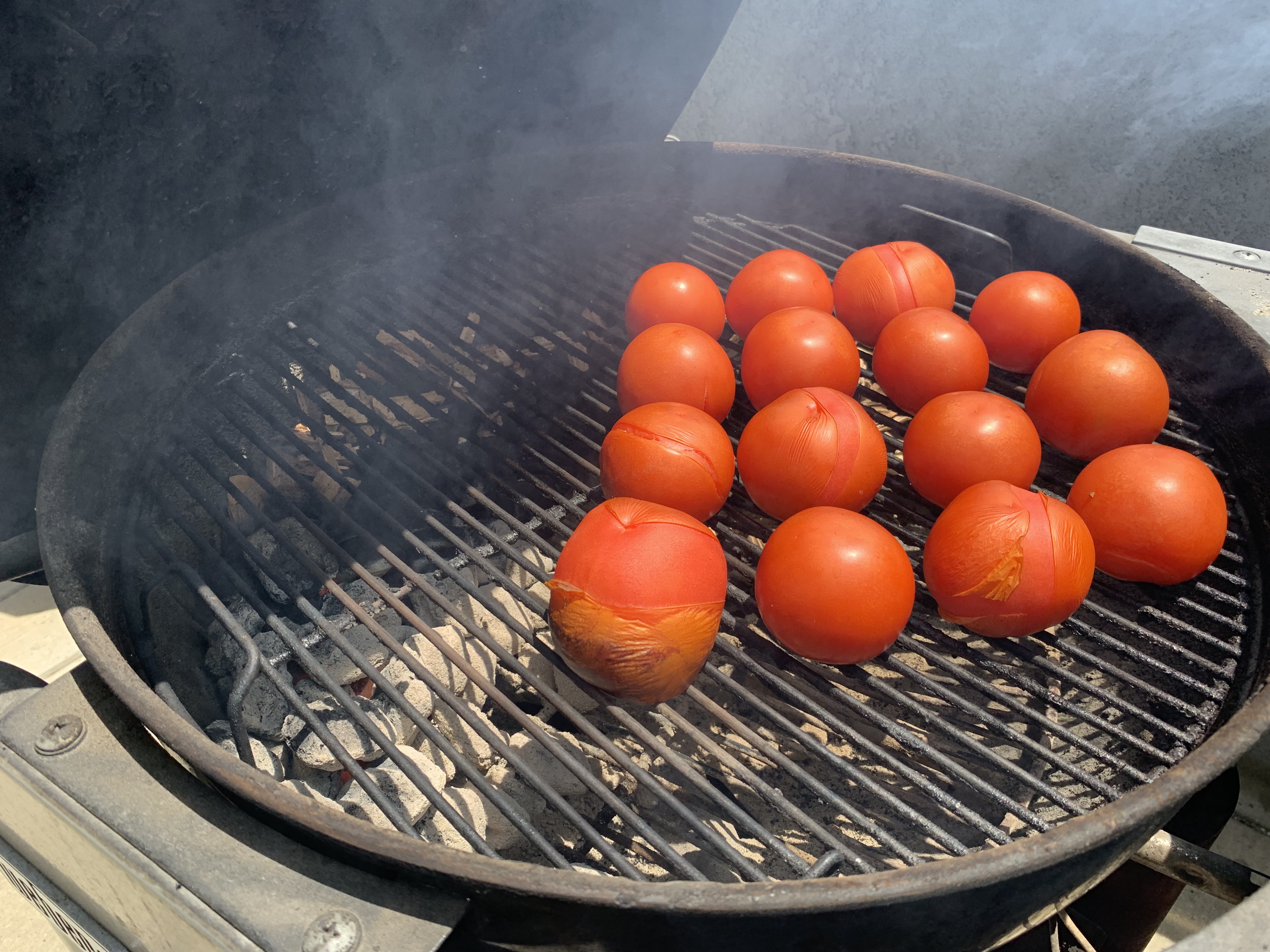 Tomatoes charring on Weber charcoal grill